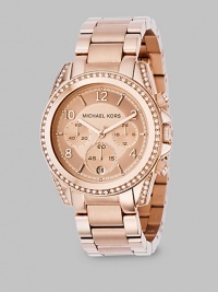 A classic chronograph with designer style, in IP (ionic plating) rose gold stainless steel with sparkling accents of Swarovski crystal. A classic chronograph with designer style, in IP (ionic plating) rose gold stainless steel with sparkling accents of Swarovski crystal.