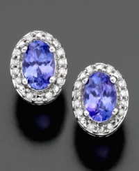 These 14k white gold earrings feature angelic oval-cut tanzanite (3/4 ct. t.w.) surrounded by round-cut diamond accents (1/10 ct. t.w.) for an illuminating effect. These 14k white gold earrings feature angelic oval-cut tanzanite (3/4 ct. t.w.) surrounded by round-cut diamond accents (1/10 ct. t.w.) for an illuminating effect.