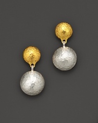 A double drop earring from Gurhan, designed with hammered 24 Kt. yellow gold and white silver discs. A double drop earring from Gurhan, designed with hammered 24 Kt. yellow gold and white silver discs.