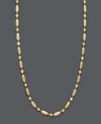 A delicate chain with subtle flair. This 14k gold necklace chain features a cylindrical and beaded dot dash design with a spring ring clasp. Approximate length: 20 inches. A delicate chain with subtle flair. This 14k gold necklace chain features a cylindrical and beaded dot dash design with a spring ring clasp. Approximate length: 20 inches.