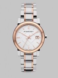 An iconic check stamped dial with the contrast of warm rose goldtone and sleek silvertone stainless steel. Swiss quartz movementWater resistant to 5 ATMRound stainless steel case, 34mm (1.3)Smooth rose goldtone bezelSilver check stamped dialBar hour markersDate display at 3 o'clockSecond hand Two-tone stainless steel link braceletMade in Switzerland An iconic check stamped dial with the contrast of warm rose goldtone and sleek silvertone stainless steel. Swiss quartz movementWater resistant to 5 ATMRound stainless steel case, 34mm (1.3)Smooth rose goldtone bezelSilver check stamped dialBar hour markersDate display at 3 o'clockSecond hand Two-tone stainless steel link braceletMade in Switzerland