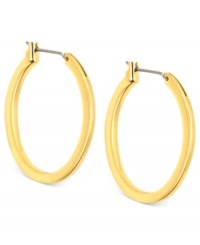 Embrace the oval shape of these hoop earrings from Anne Klein. Crafted from gold-tone mixed metal, the pair puts a stylish twist on a classic silhouette. Approximate diameter: 3/4 inch. Embrace the oval shape of these hoop earrings from Anne Klein. Crafted from gold-tone mixed metal, the pair puts a stylish twist on a classic silhouette. Approximate diameter: 3/4 inch.