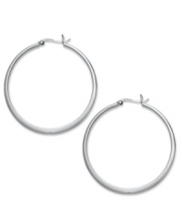 Take your look up a notch with simply stunning hoops. Touch of Silver's thin, polished design is crafted in silver-plated brass with a sterling silver click backing. Approximate diameter: 1-5/8 inches. Take your look up a notch with simply stunning hoops. Touch of Silver's thin, polished design is crafted in silver-plated brass with a sterling silver click backing. Approximate diameter: 1-5/8 inches.