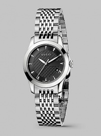 From the G-Timeless Collection. A prestigous design with classic, round face and diamond-patterned dial is crafted in the durability and lasting elegance of stainless steel. Stainless steel case diameter; 27mm (1.06) Precision quartz movement Water-resistant to 3ATM Stainless steel bezel Round face Black diamond-pattern dial Markers Second hand Date display at 4 o'clock Stainless steel bracelet Made in Switzerland From the G-Timeless Collection. A prestigous design with classic, round face and diamond-patterned dial is crafted in the durability and lasting elegance of stainless steel. Stainless steel case diameter; 27mm (1.06) Precision quartz movement Water-resistant to 3ATM Stainless steel bezel Round face Black diamond-pattern dial Markers Second hand Date display at 4 o'clock Stainless steel bracelet Made in Switzerland