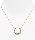 Catch good luck in this glittering 18 Kt. gold plate horseshoe, encrusted with starry Swarovski crystals. By Alexis Bittar.