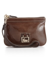 A glossy sheen and timeless sensibility make this a leather wristlet for the sophisticated boho chick. A glossy sheen and timeless sensibility make this a leather wristlet for the sophisticated boho chick.