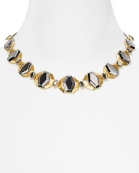 Steal glances when you walk into the room with this Carolee collar necklace, crafted of chunky gold and gunmetal plated stations.