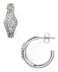 Pave-set crystals and a delicate shape elevate these classic rhodium-plated hoop earrings from Nadri from ordinary to opulent. Pave-set crystals and a delicate shape elevate these classic rhodium-plated hoop earrings from Nadri from ordinary to opulent.