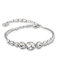 Love story. As soon as you set eyes on Swarovski's romantic Nouba Bangle, we're certain it will be love at first sight! Adorned with heart-shaped clear crystals in a bezel setting, it's crafted in silver tone mixed metal. Approximate diameter: 2-1/4 inches + 1-1/2-inch extender. Love story. As soon as you set eyes on Swarovski's romantic Nouba Bangle, we're certain it will be love at first sight! Adorned with heart-shaped clear crystals in a bezel setting, it's crafted in silver tone mixed metal. Approximate diameter: 2-1/4 inches + 1-1/2-inch extender.