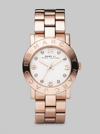 A glowing and sparkling timepiece with a polished IP rose gold finish over stainless steel and a bold link bracelet. Precision quartz movement Water-resistant to 3ATM Signature bezel Round stainless steel case; 36mm diameter (1.42) White dial Arabic numerals and rhinestone hour markers Second hand Link bracelet; 20mm wide (.79) Imported A glowing and sparkling timepiece with a polished IP rose gold finish over stainless steel and a bold link bracelet. Precision quartz movement Water-resistant to 3ATM Signature bezel Round stainless steel case; 36mm diameter (1.42) White dial Arabic numerals and rhinestone hour markers Second hand Link bracelet; 20mm wide (.79) Imported