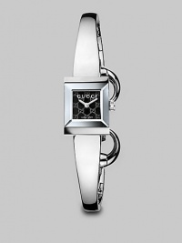From the G-Frame Collection. A sophisticated bangle with a black GG pattern dial and a stainless steel case. Swiss quartz movementWater resistant to 3 ATMSquare stainless steel case, 14mm (0.5) X 18mm (0.7)Smooth bezelBlack GG pattern dialStainless steel bangleMade in Switzerland From the G-Frame Collection. A sophisticated bangle with a black GG pattern dial and a stainless steel case. Swiss quartz movementWater resistant to 3 ATMSquare stainless steel case, 14mm (0.5) X 18mm (0.7)Smooth bezelBlack GG pattern dialStainless steel bangleMade in Switzerland