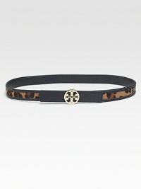 A studded logo closure is accented by pebbled leather and luxurious haircalf.Width, about 1Made in USA A studded logo closure is accented by pebbled leather and luxurious haircalf.Width, about 1Made in USA