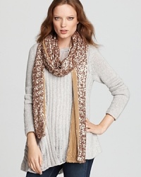 Splash sequins across any ensemble in Rachel Zoe's glitzy, extra-long scarf, lined with soft velvet. Splash sequins across any ensemble in Rachel Zoe's glitzy, extra-long scarf, lined with soft velvet.