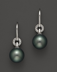 A timeless classic, these Tara Pearls earrings combine 18K white gold with Tahitian black pearls, detailed with sparkling diamond accents. A timeless classic, these Tara Pearls earrings combine 18K white gold with Tahitian black pearls, detailed with sparkling diamond accents.