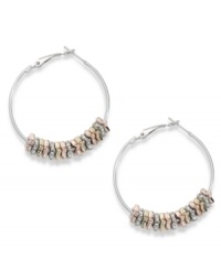 Put on the charm. Bar III's hoop earrings embrace crystal shimmer with tri-tone accents in rose-gold, gold and silver tones. Crafted in silver tone mixed metal. Approximate diameter: 1-1/2 inches. Put on the charm. Bar III's hoop earrings embrace crystal shimmer with tri-tone accents in rose-gold, gold and silver tones. Crafted in silver tone mixed metal. Approximate diameter: 1-1/2 inches.