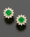 A fresh take on a classic look, these royalty-inspired earrings by Effy Collection feature round-cut emeralds (1/2 ct. t.w.) and diamond accents set in 14k gold. Approximate diameter: 1/3 inch.