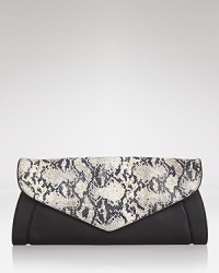 We love simply styled accessories that can go anywhere (and with anything,) and this leather See by Chloé clutch is no exception, detailed by an embossed flap closure. We love simply styled accessories that can go anywhere (and with anything,) and this leather See by Chloé clutch is no exception, detailed by an embossed flap closure.
