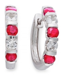 Add a little glam to a classic pair of hoops. Channel-set, round-cut rubies (1-3/8 ct. t.w.) and white sapphires (9/10 ct. t.w.) glisten within a sterling silver setting. Approximate diameter: 21.5 mm. Add a little glam to a classic pair of hoops. Channel-set, round-cut rubies (1-3/8 ct. t.w.) and white sapphires (9/10 ct. t.w.) glisten within a sterling silver setting. Approximate diameter: 21.5 mm.