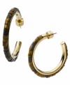 Tortoise shell hues aren't just for sunglasses anymore! Michael Kors puts the cool back into hoops with this updated style. A three-quarter hoop features intricate acrylic beading in tortoise shell hues. Set in gold tone mixed metal. Approximate diameter: 1-1/4 inches. Approximate width: 1/8 inch.