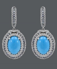 Tantalize the senses with this tasteful style. Carlo Viani's delightfully dramatic drop earrings feature oval-cut turquoise (8 mm) surrounded by rings of round-cut blue topaz (1-1/3 ct. t.w.) and white sapphire (2-1/2 ct. t.w.). Crafted in 14k white gold. Approximate drop: 1-1/2 inches. Tantalize the senses with this tasteful style. Carlo Viani's delightfully dramatic drop earrings feature oval-cut turquoise (8 mm) surrounded by rings of round-cut blue topaz (1-1/3 ct. t.w.) and white sapphire (2-1/2 ct. t.w.). Crafted in 14k white gold. Approximate drop: 1-1/2 inches.