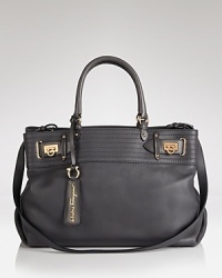 Salvatore Ferragamo's rich leather satchel works a conservative allure, energized with subtle touches that gives even the simplest outfit a sophisticated edge. Salvatore Ferragamo's rich leather satchel works a conservative allure, energized with subtle touches that gives even the simplest outfit a sophisticated edge.