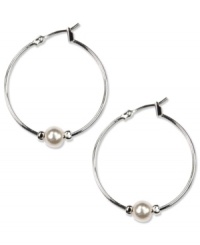 Perfectly polished. These Anne Klein classic hoop earrings feature added elegance with white plastic pearls and glass stone accents. Crafted in imitation rhodium-plated mixed metal. Approximate diameter: 1-1/4 inches. Perfectly polished. These Anne Klein classic hoop earrings feature added elegance with white plastic pearls and glass stone accents. Crafted in imitation rhodium-plated mixed metal. Approximate diameter: 1-1/4 inches.
