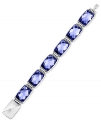 Discover bliss with Swarovski's Nirvana bracelet. It is crafted from rhodium-plated stainless steel with Tanzanite crystals inspiring tranquility. Approximate length: 8 inches. Discover bliss with Swarovski's Nirvana bracelet. It is crafted from rhodium-plated stainless steel with Tanzanite crystals inspiring tranquility. Approximate length: 8 inches.
