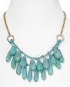 Take this season's love of bold colors to your jewel box with this beaded bib necklace from Aqua, accented by a cluster of turquoise drop beads and a textured chain.