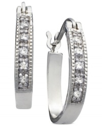 Channel your inner star with these sparkling diamond channel hoops (1/10 ct. t.w.) set in sterling silver. Approximate diameter: 1/10 inch. Channel your inner star with these sparkling diamond channel hoops (1/10 ct. t.w.) set in sterling silver. Approximate diameter: 1/10 inch.