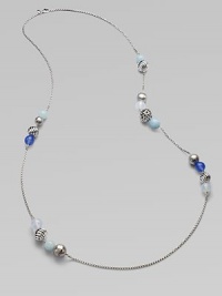 From the Elements Collection. A delicate, sterling silver chain link with smooth blue chalcedony, aquamarine, moon quartz and and multi-textural sterling silver beads in a clustered station design. Blue chalcedony, aquamarine, moon quartz Sterling silverLength, about 40Lobster clasp closureImported 