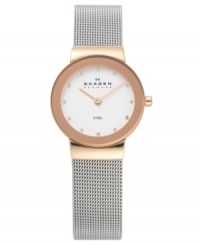 Steel and rose gold create a stunning combination on this lovely watch by Skagen Denmark. Stainless steel mesh bracelet and round rose gold tone case. Silver tone dial features Swarovski elements at markers, two rose gold tone hands and logo. Quartz movement. Water resistant to 30 meters. Limited lifetime warranty. Steel and rose gold create a stunning combination on this lovely watch by Skagen Denmark. Stainless steel mesh bracelet and round rose gold tone case. Silver tone dial features Swarovski elements at markers, two rose gold tone hands and logo. Quartz movement. Water resistant to 30 meters. Limited lifetime warranty.