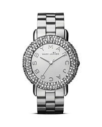 Layers of crystals illuminate a bold mirrored dial on this MARC BY MARC JACOBS plated metal watch, while an all-around logo adds a hit of brand's signature glamor. Layers of crystals illuminate a bold mirrored dial on this MARC BY MARC JACOBS plated metal watch, while an all-around logo adds a hit of brand's signature glamor.