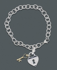 Lock your heart...but don't throw away the key. Keep them side by side on this darling sterling silver bracelet featuring a diamond heart charm (1/5 ct. t.w.) and 14k gold key. Approximate length: 7 inches. Approximate charm drop: 7/8 inch. Lock your heart...but don't throw away the key. Keep them side by side on this darling sterling silver bracelet featuring a diamond heart charm (1/5 ct. t.w.) and 14k gold key. Approximate length: 7 inches. Approximate charm drop: 7/8 inch.