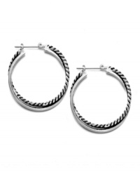 A stylish new spin. Hoop earrings are always a fashionable favorite in jewelry, but this Lauren by Ralph Lauren version literally takes on a modern twist. Set in silver tone mixed metal. Approximate diameter: 1-1/4 inches.