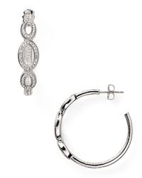 Crafted from rhodium plated metal and crystal stations, Nadri's open link hoop earrings encapsulate sophisticated accessorizing. Crafted from rhodium plated metal and crystal stations, Nadri's open link hoop earrings encapsulate sophisticated accessorizing.