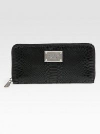 Chic and luxurious snake embossed leather design with a logo plaque.Zip-around closureOne inside zip pocketEight credit card slotsTwo bill compartmentsFully lined8¼W X 4H X ¾DImported Chic and luxurious snake embossed leather design with a logo plaque.Zip-around closureOne inside zip pocketEight credit card slotsTwo bill compartmentsFully lined8¼W X 4H X ¾DImported