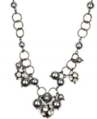Luxe links. AK Anne Klein's chain link necklace makes a striking statement. With lustrous acrylic pearls in a gorgeous shade of gray as well as glittering glass accents, it's crafted in hematite tone mixed metal. Approximate length: 16 inches. Luxe links. AK Anne Klein's chain link necklace makes a striking statement. With lustrous acrylic pearls in a gorgeous shade of gray as well as glittering glass accents, it's crafted in hematite tone mixed metal. Approximate length: 16 inches.