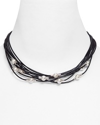 Multiple leather strands are punctuated with softly glowing pearls in this necklace from Majorica. Multiple leather strands are punctuated with softly glowing pearls in this necklace from Majorica.