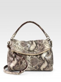 The perfect carryall for all your essentials in luxurious snake embossed leather.Double top handles, 4½ dropDetachable adjustable shoulder strap, 19-21½ dropMagnetic flap closureProtective metal feetOne zip pocket on flapOne inside zip pocketTwo inside open pocketsCotton lining13W X 8½H X 5½DImported The perfect carryall for all your essentials in luxurious snake embossed leather.Double top handles, 4½ dropDetachable adjustable shoulder strap, 19-21½ dropMagnetic flap closureProtective metal feetOne zip pocket on flapOne inside zip pocketTwo inside open pocketsCotton lining13W X 8½H X 5½DImported