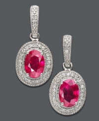 Captivate the room with these dazzling drop earrings. Oval-cut ruby (2-1/5 ct. t.w.) takes center stage among glittering round-cut diamond (1/6 ct. t.w.) set in 14k white gold. Approximate drop: 3/4 inch. Captivate the room with these dazzling drop earrings. Oval-cut ruby (2-1/5 ct. t.w.) takes center stage among glittering round-cut diamond (1/6 ct. t.w.) set in 14k white gold. Approximate drop: 3/4 inch.