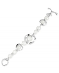 Classic meets contemporary in this bracelet from Robert Lee Morris. Crafted from silver-tone mixed metal and featuring simulated pearl accents centered in a geometric shape, the bracelet updates a timeless style. Approximate length: 7-1/2 inches. Classic meets contemporary in this bracelet from Robert Lee Morris. Crafted from silver-tone mixed metal and featuring simulated pearl accents centered in a geometric shape, the bracelet updates a timeless style. Approximate length: 7-1/2 inches.