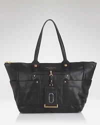 MARC BY MARC JACOBS' lush leather tote is daytime ready. Boasting a chic shape and ample square footage, this bag is designed to handle the essentials, plus loads more. MARC BY MARC JACOBS' lush leather tote is daytime ready. Boasting a chic shape and ample square footage, this bag is designed to handle the essentials, plus loads more.