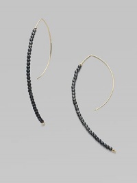 A striking modernist shape strung with oxidized sterling silver beads capped with 14k yellow gold beads.14k yellow gold Oxidized sterling silver Length, about 2¾ Pierced Made in USA A striking modernist shape strung with oxidized sterling silver beads capped with 14k yellow gold beads.14k yellow gold Oxidized sterling silver Length, about 2¾ Pierced Made in USA