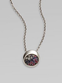 From the Eclipse Collection. A chunky round disc paved with an array of faceted gemstones sits within a sleek setting of polished sterling silver on a silver chain.Blue sapphires, sky blue topaz, iolite and rhodoliteSterling silverChain length, adjusts from about 16-18Pendant diameter, about ½Lobster claspImported From the Eclipse Collection. A chunky round disc paved with an array of faceted gemstones sits within a sleek setting of polished sterling silver on a silver chain.Blue sapphires, sky blue topaz, iolite and rhodoliteSterling silverChain length, adjusts from about 16-18Pendant diameter, about ½Lobster claspImported