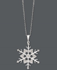 Let it snow, let it snow, let it snow! This intricate cut-out pendant features a beautiful snowflake dusted by round-cut diamonds (1/10 ct. t.w.). Crafted in sterling silver. Approximate length: 18 inches. Approximate drop: 1-2/10 inches. Let it snow, let it snow, let it snow! This intricate cut-out pendant features a beautiful snowflake dusted by round-cut diamonds (1/10 ct. t.w.). Crafted in sterling silver. Approximate length: 18 inches. Approximate drop: 1-2/10 inches.