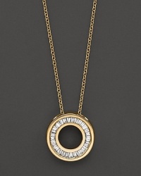 A dazzling circle of diamond baguettes, set in gleaming 14K yellow gold. A dazzling circle of diamond baguettes, set in gleaming 14K yellow gold.