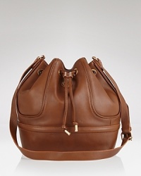 Crafted of ultra-soft leather in a slouch-perfect shape. Tory Burch's bucket bag is a cooler take on the classic carryall, with ample space and pockets for storing desk-to-dinner essentials. Crafted of ultra-soft leather in a slouch-perfect shape. Tory Burch's bucket bag is a cooler take on the classic carryall, with ample space and pockets for storing desk-to-dinner essentials.