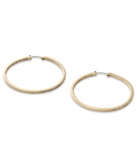 These timeless hoop earrings from Fossil get a glitzy upgrade with black diamond crystal accents. Crafted in shiny gold tone mixed metal. Approximate diameter: 2 inches. These timeless hoop earrings from Fossil get a glitzy upgrade with black diamond crystal accents. Crafted in shiny gold tone mixed metal. Approximate diameter: 2 inches.