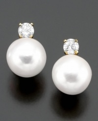 Classically beautiful jewelry with lasting style. These earrings feature cultured freshwater pearl (7-8 mm) and round-cut diamond (1/4 ct. t.w.) set in 14k gold. Classically beautiful jewelry with lasting style. These earrings feature cultured freshwater pearl (7-8 mm) and round-cut diamond (1/4 ct. t.w.) set in 14k gold.