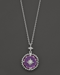 A delicate, feminine pendant on a sterling silver chain in purple crystal with white sapphire accents. A delicate, feminine pendant on a sterling silver chain in purple crystal with white sapphire accents.